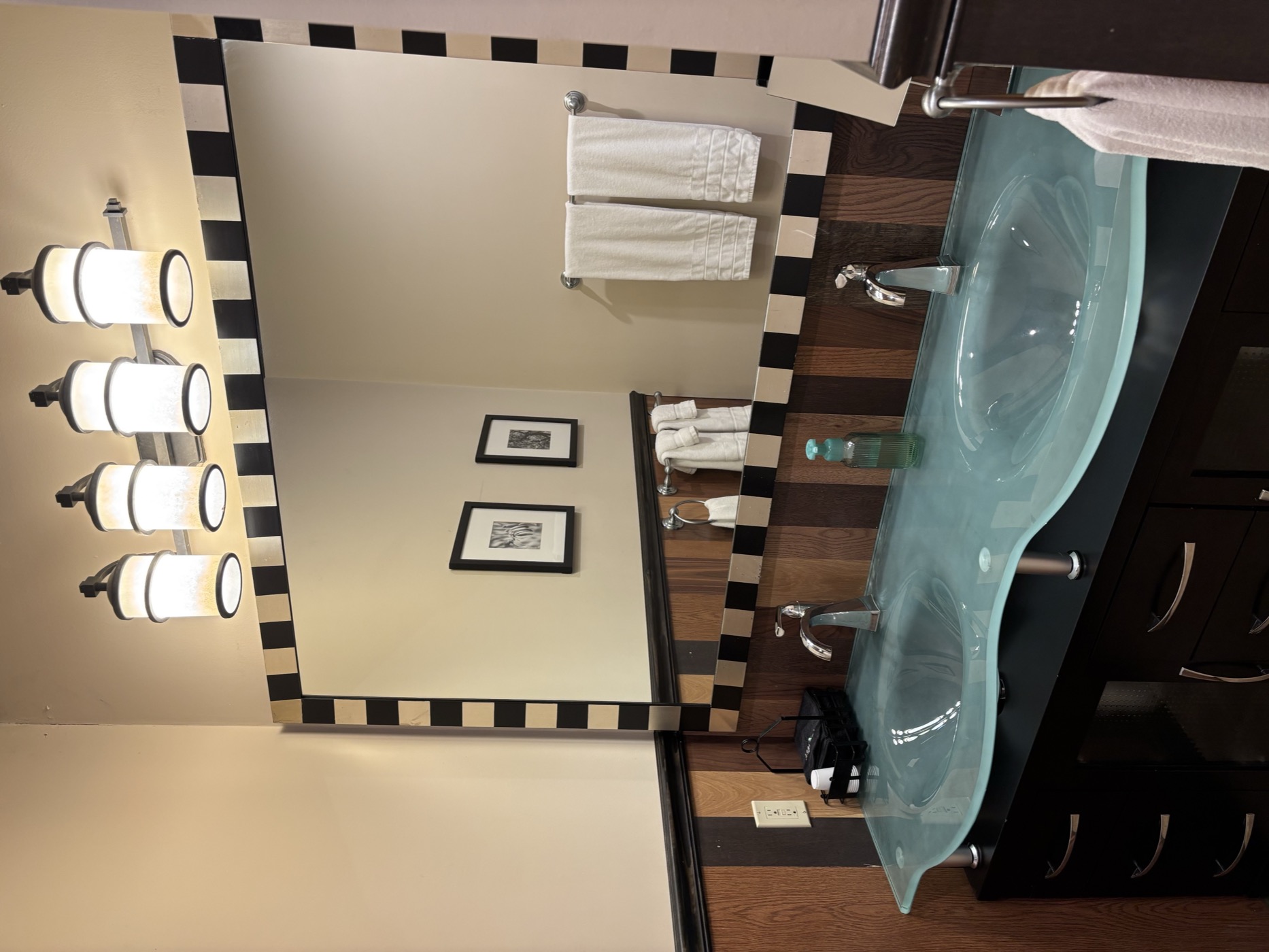 The third bathroom&rsquo;s double glass sinks and checkered mirror, seen in full