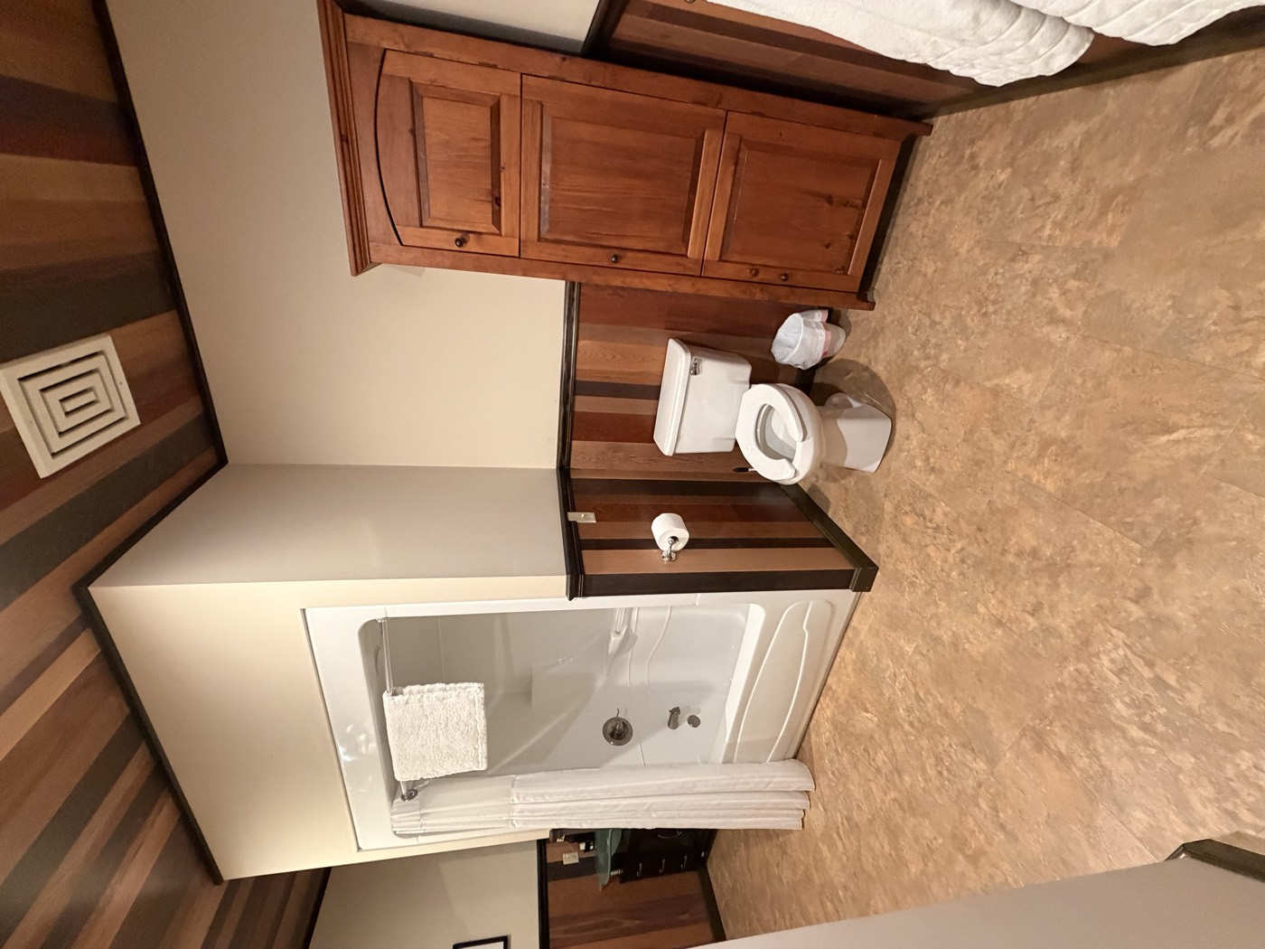 A bathroom with a walk-in shower and double vanity