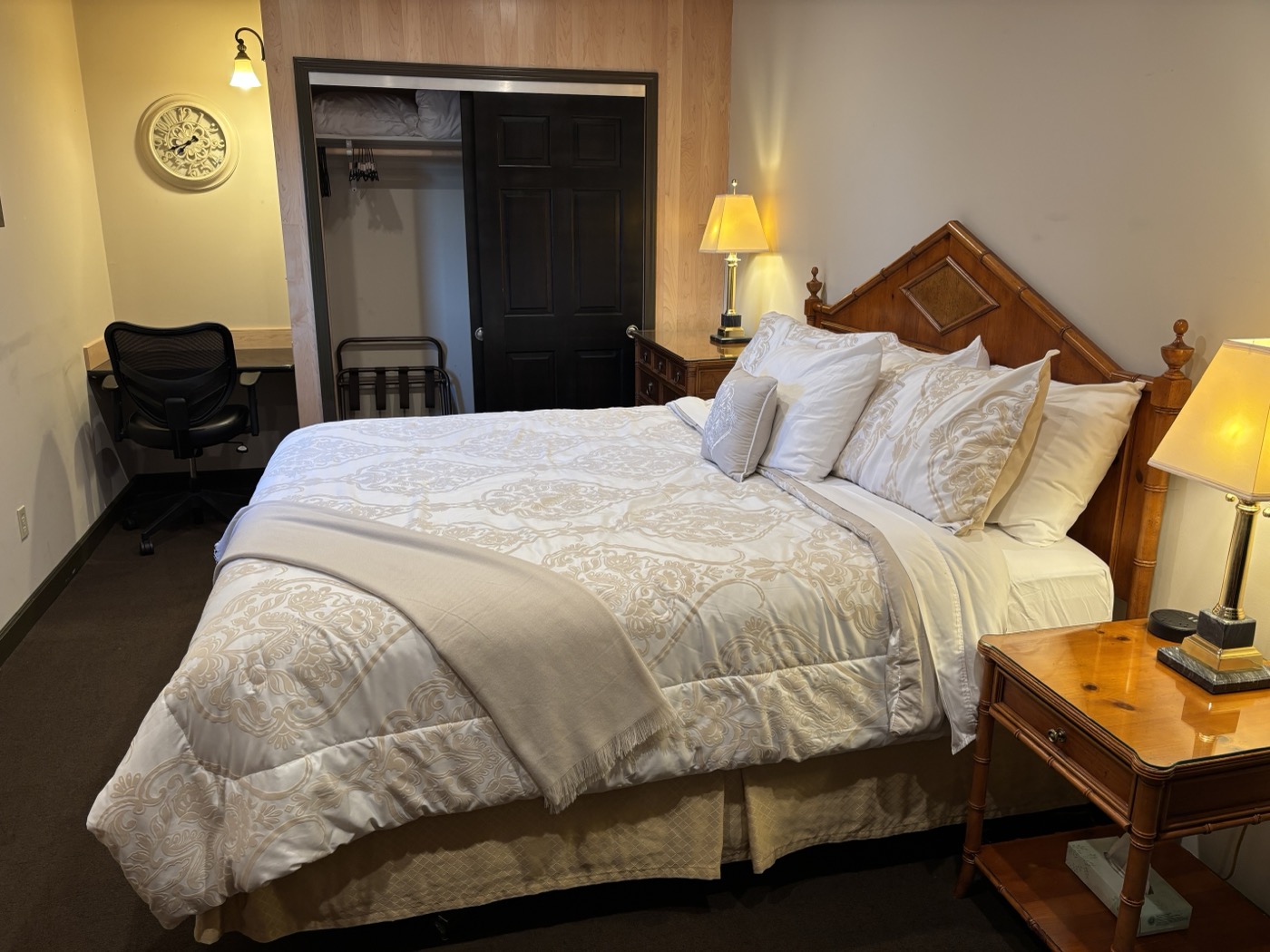 The second king bedroom — a king bed, a desk with a chair, and a closet
